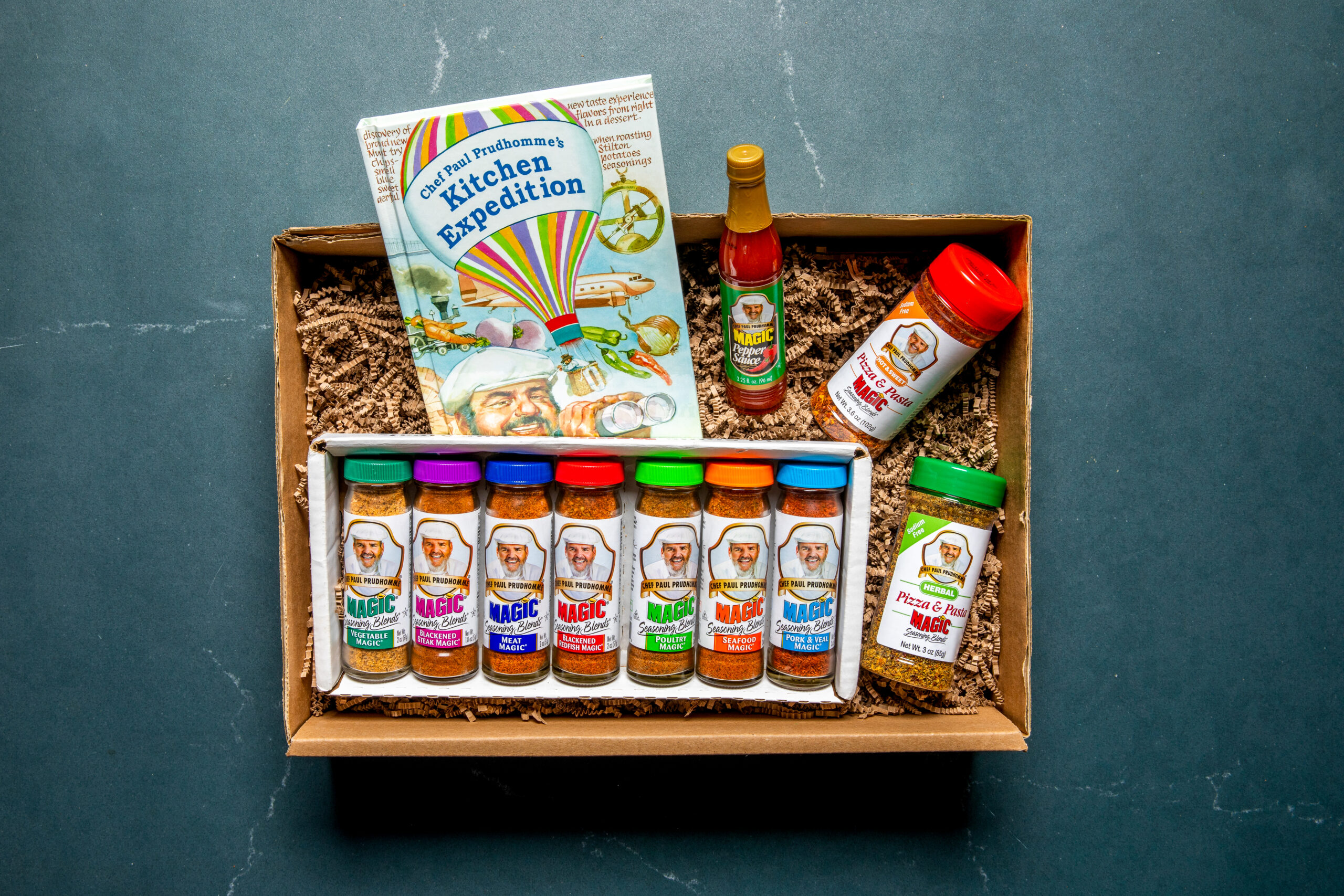 Magic seasoning gift box including Kitchen Expedition cookbook, seasonings, and pepper sauce