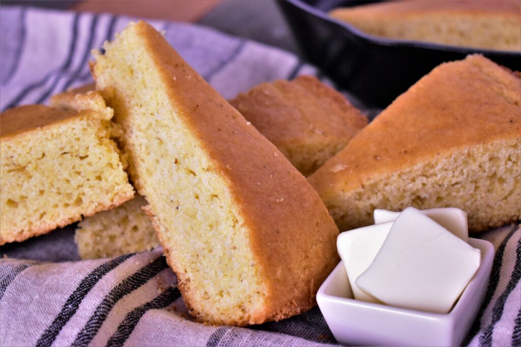 5 pieces of cornbread cut and stacked on top of eachother