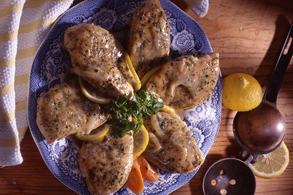a plate of lemon dill chicken cooked with reduced fat, calorie and sodium contents