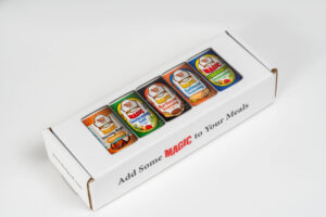 the front of the box containing 5 containers of magic seasoning blends