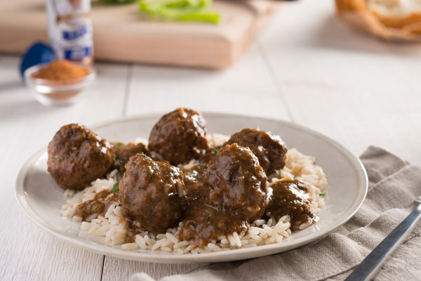 a palte full of Meatball Stew with rice