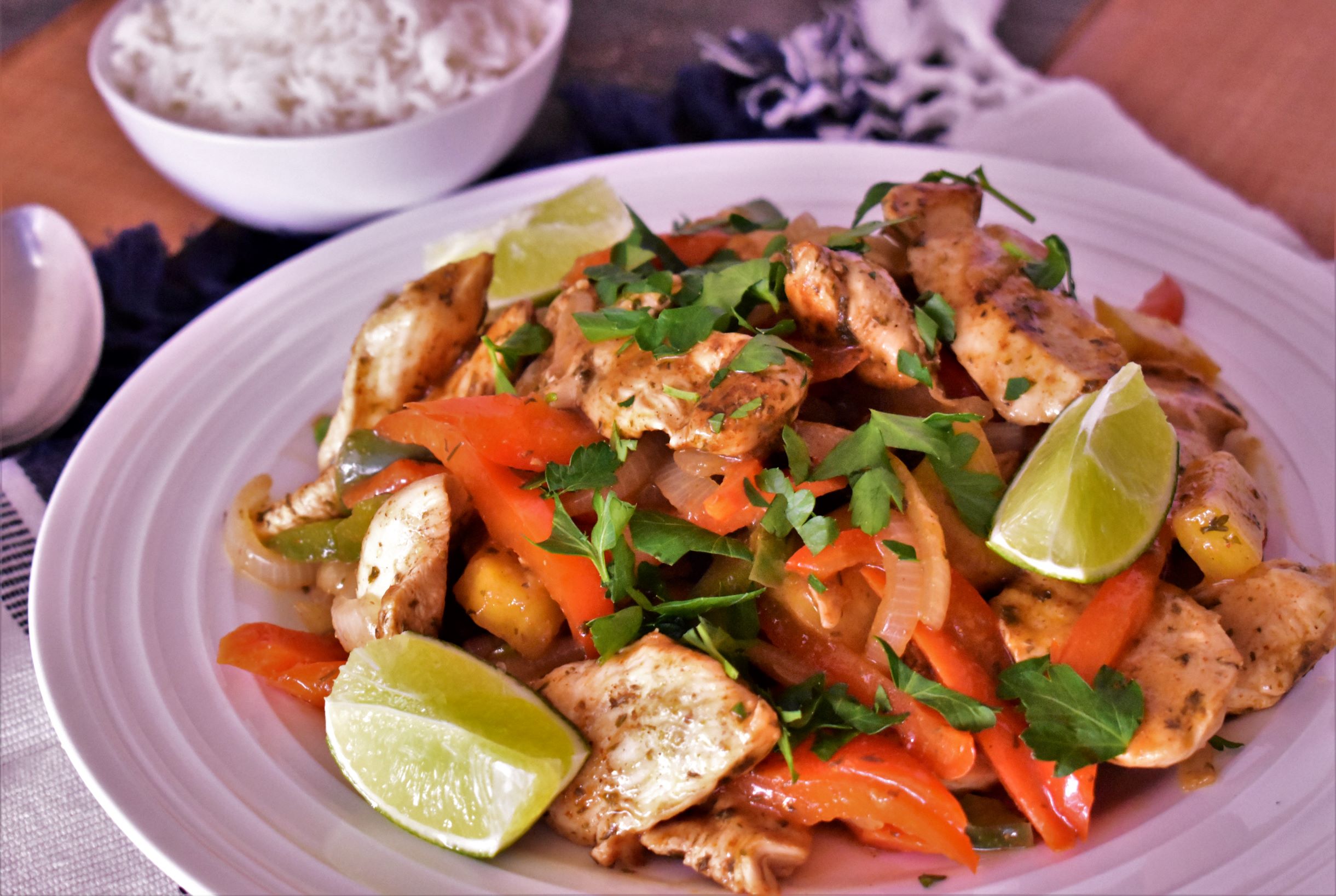 a plate full of pineapple chicken stir fry cooked with salt free sugar free magic seasoning blends