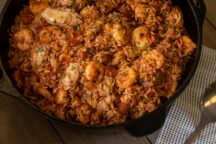 a cast iron pot of seafood andouille tasso jambalaya