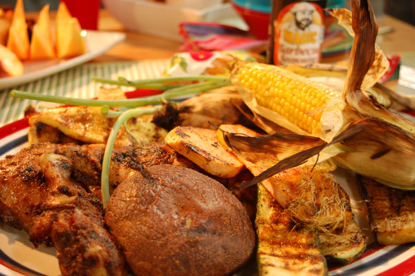 a close up of a plate full of grilled chicken