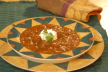 a plate of western chili with a dollap of sour cream on top
