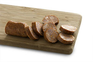 Sliced sausages on a wooden cutting board
