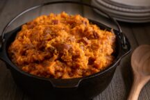 a cast iron pot of roasted sweet potato mash