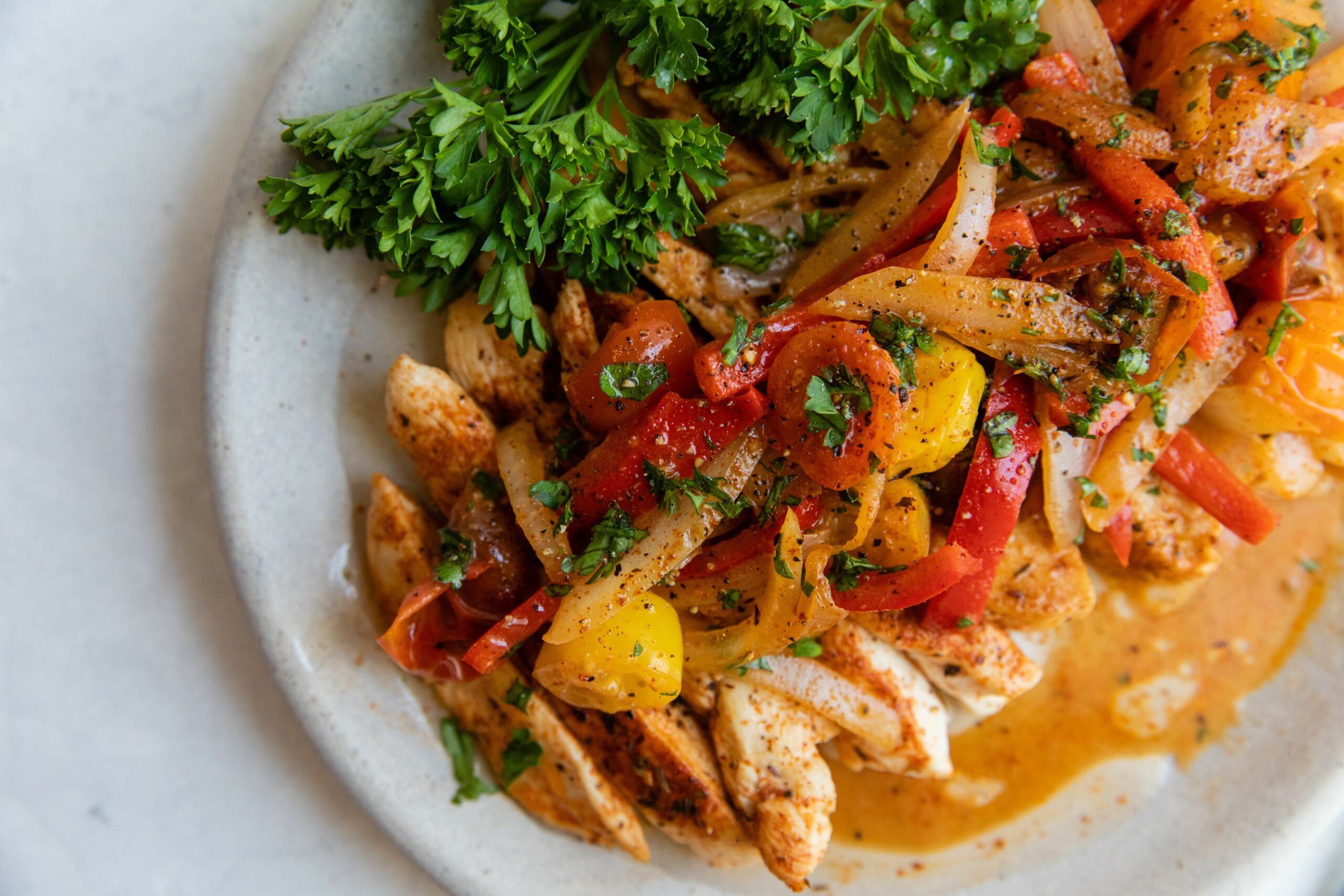 a plate of chipotle chicken with fajita butter sauce