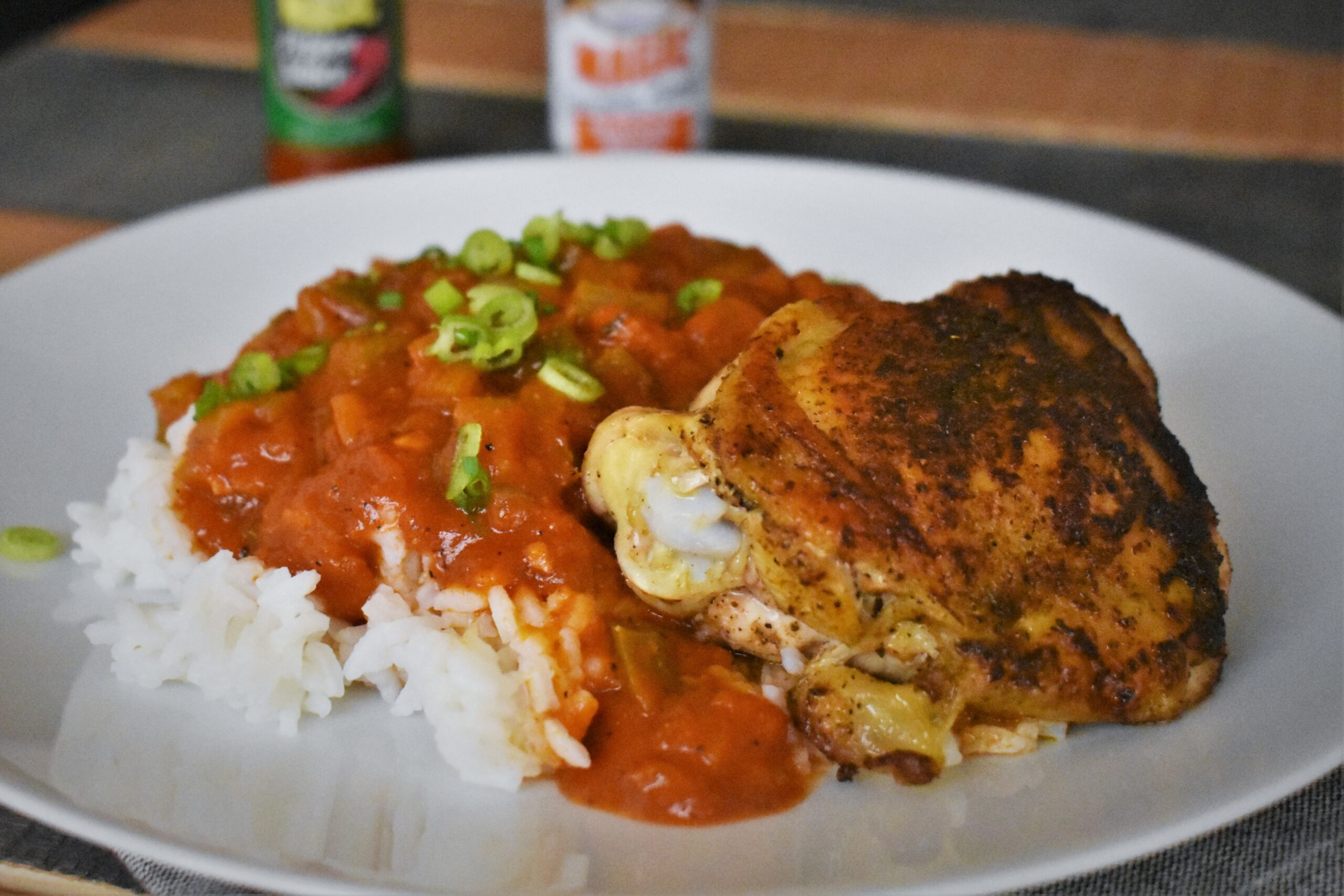 a palte of creole sauce on top of rice