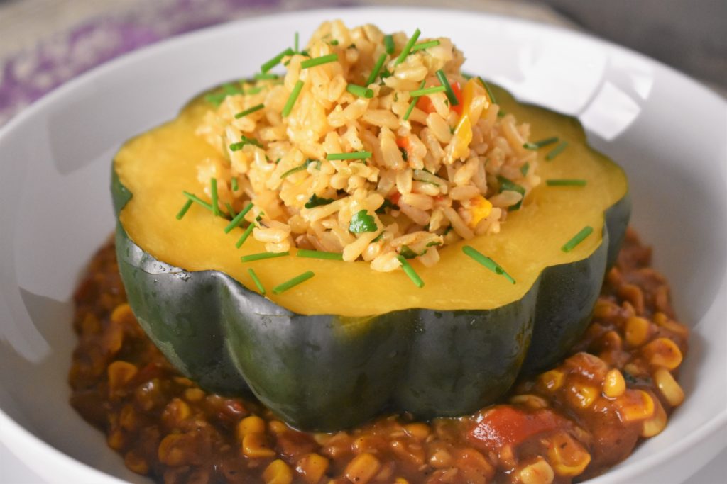 a bowl of stuffed acorn squash stuffed with rice