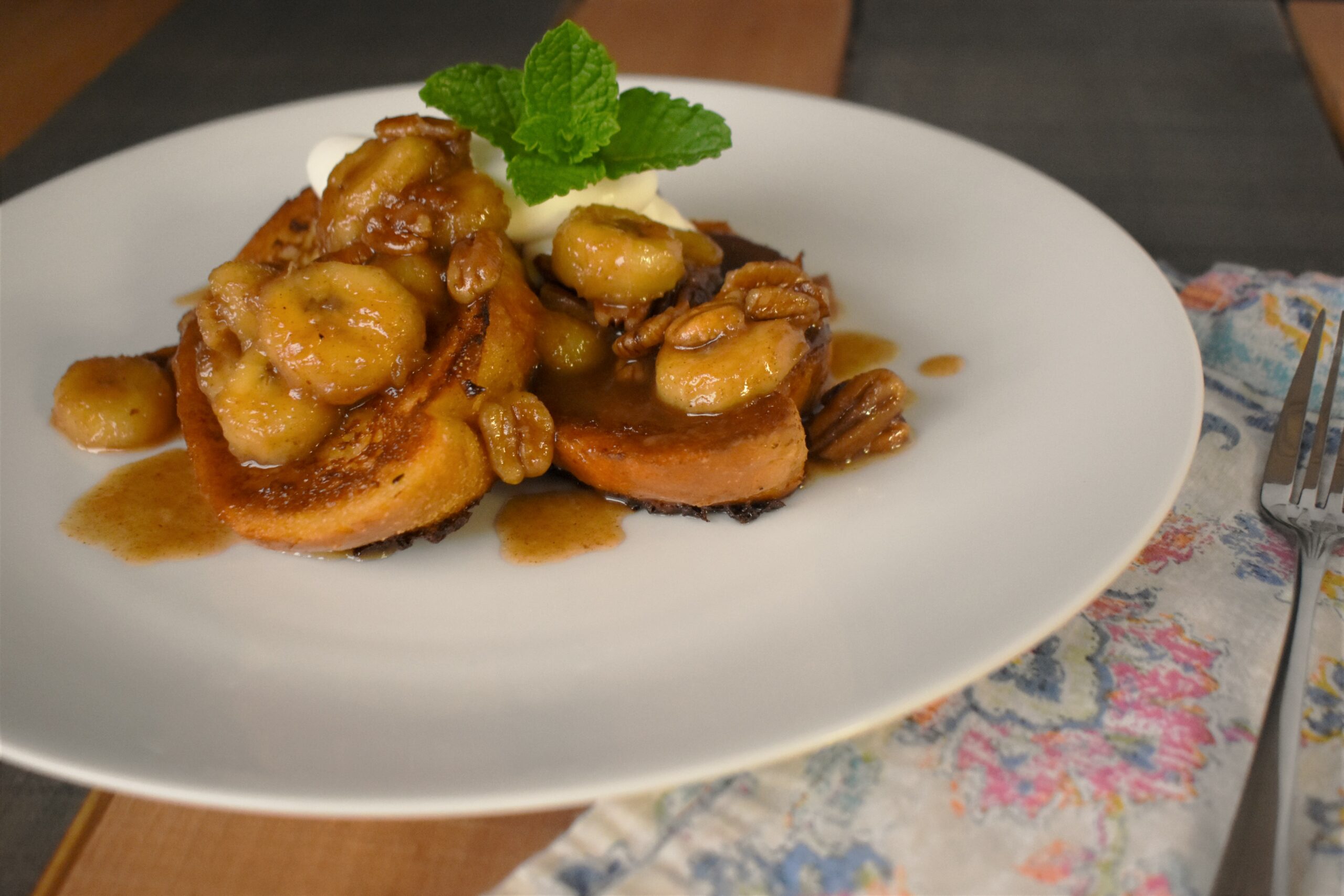 a plate of french quarter toast with peacans