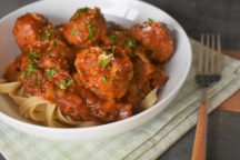 a bowl of meatballs and herbal marinara and noodles