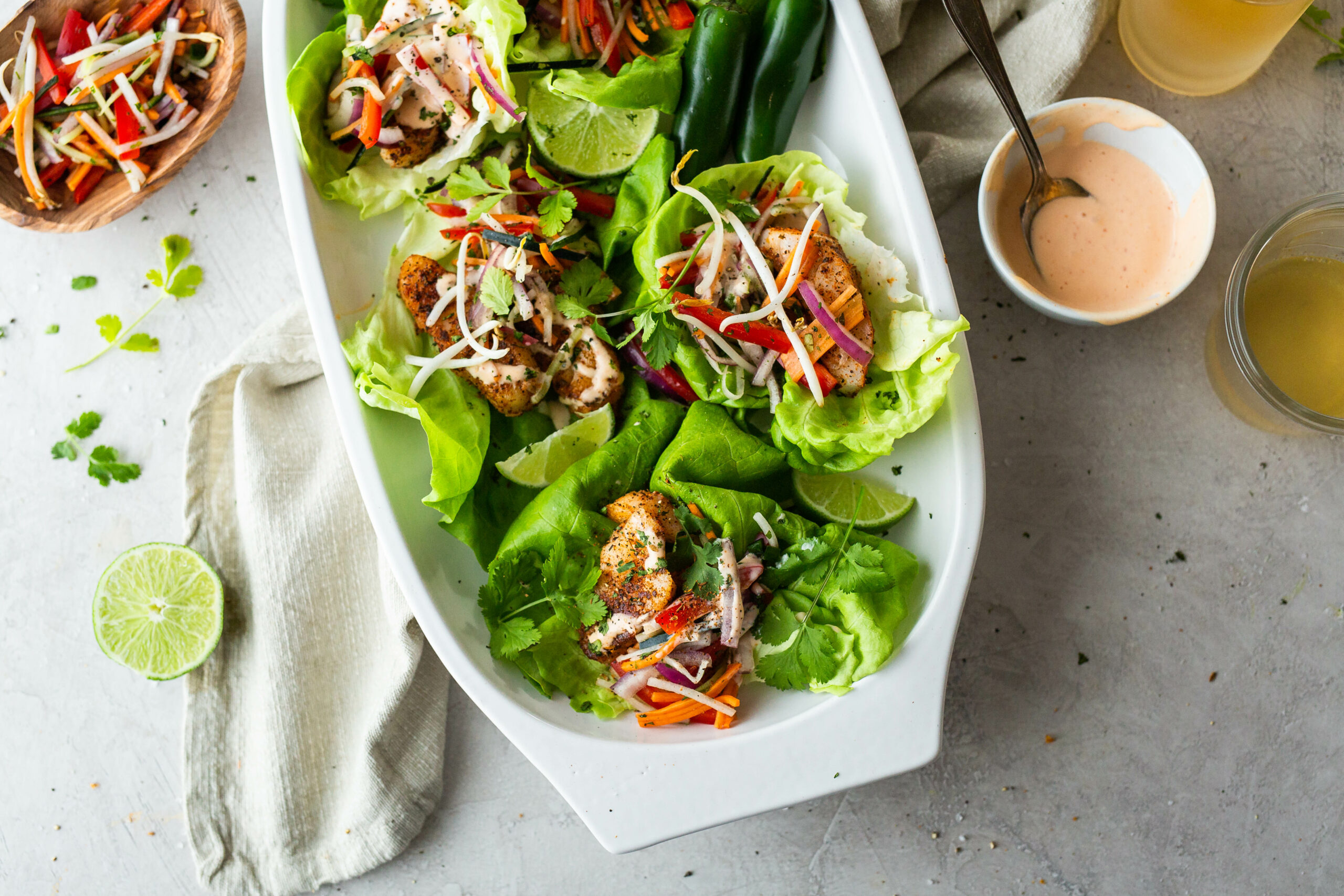 a plate of bronzed fish lettuce wraps