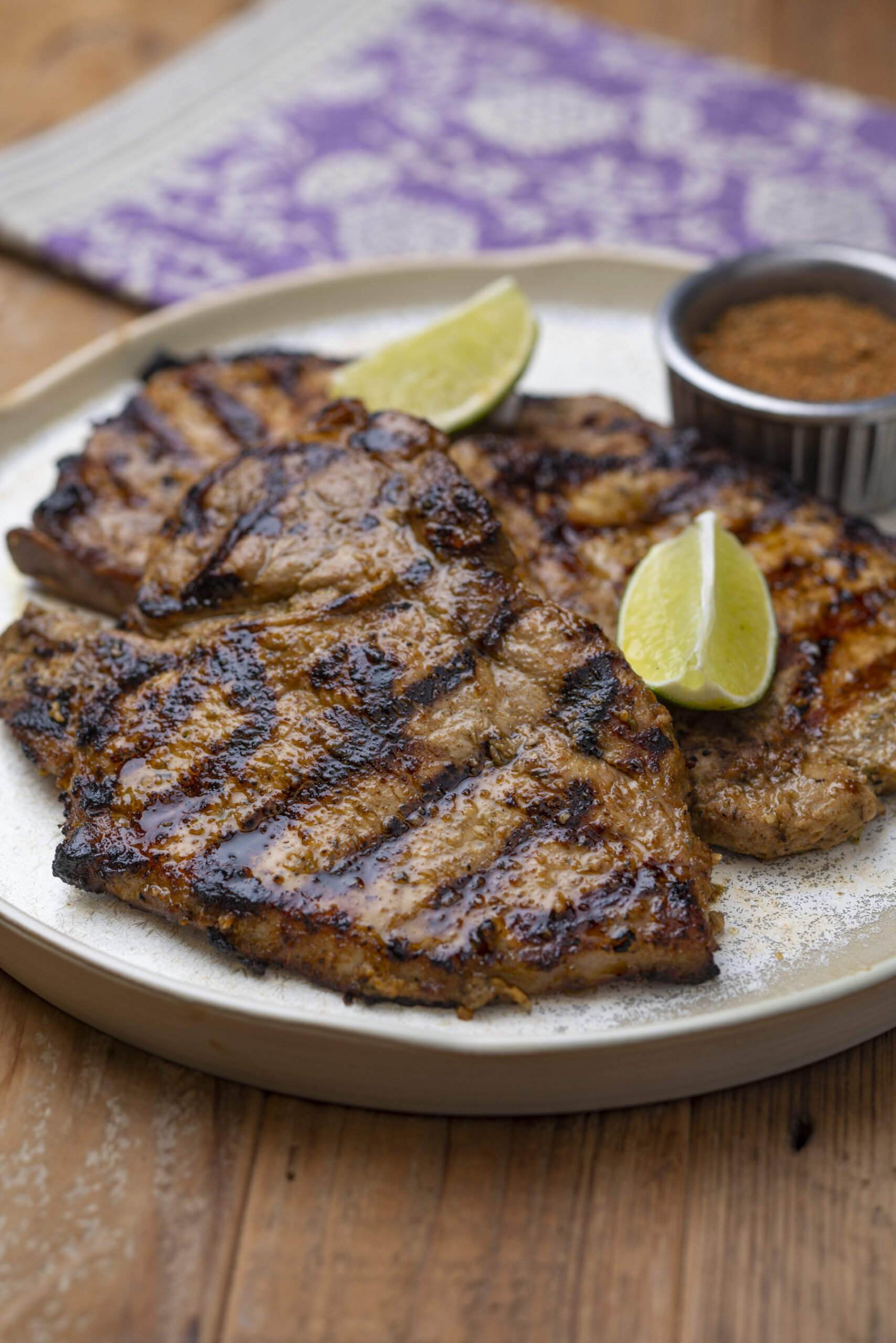 a plate of asian marinated grilled pork steaks with salt free sugar free magic seasoning