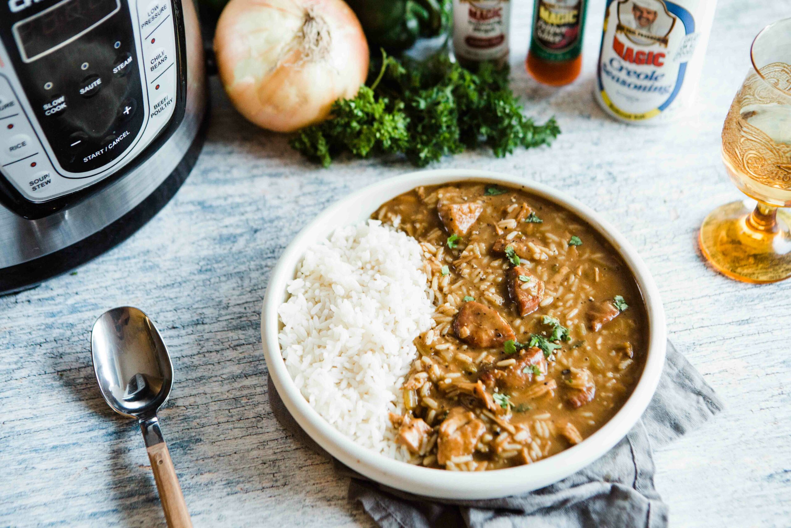 a plate of instapot leftover turkey gumbo with a side serving of rice