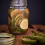 a mason jar full of salmon magic pickles