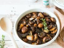 a bowl of balsamic mushrooms with shallots and thyme