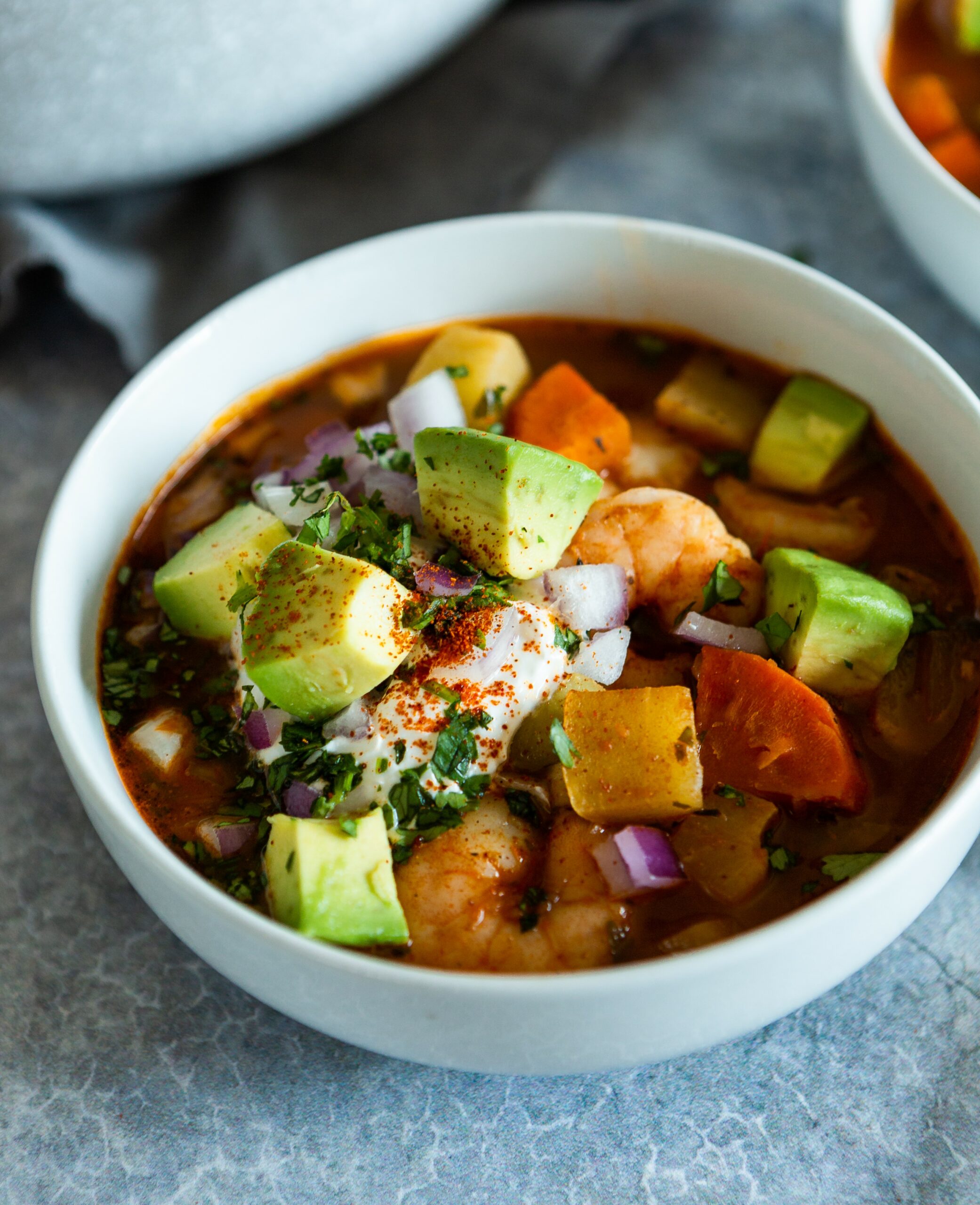 a bowl of chipotle shrimp and chayote soup