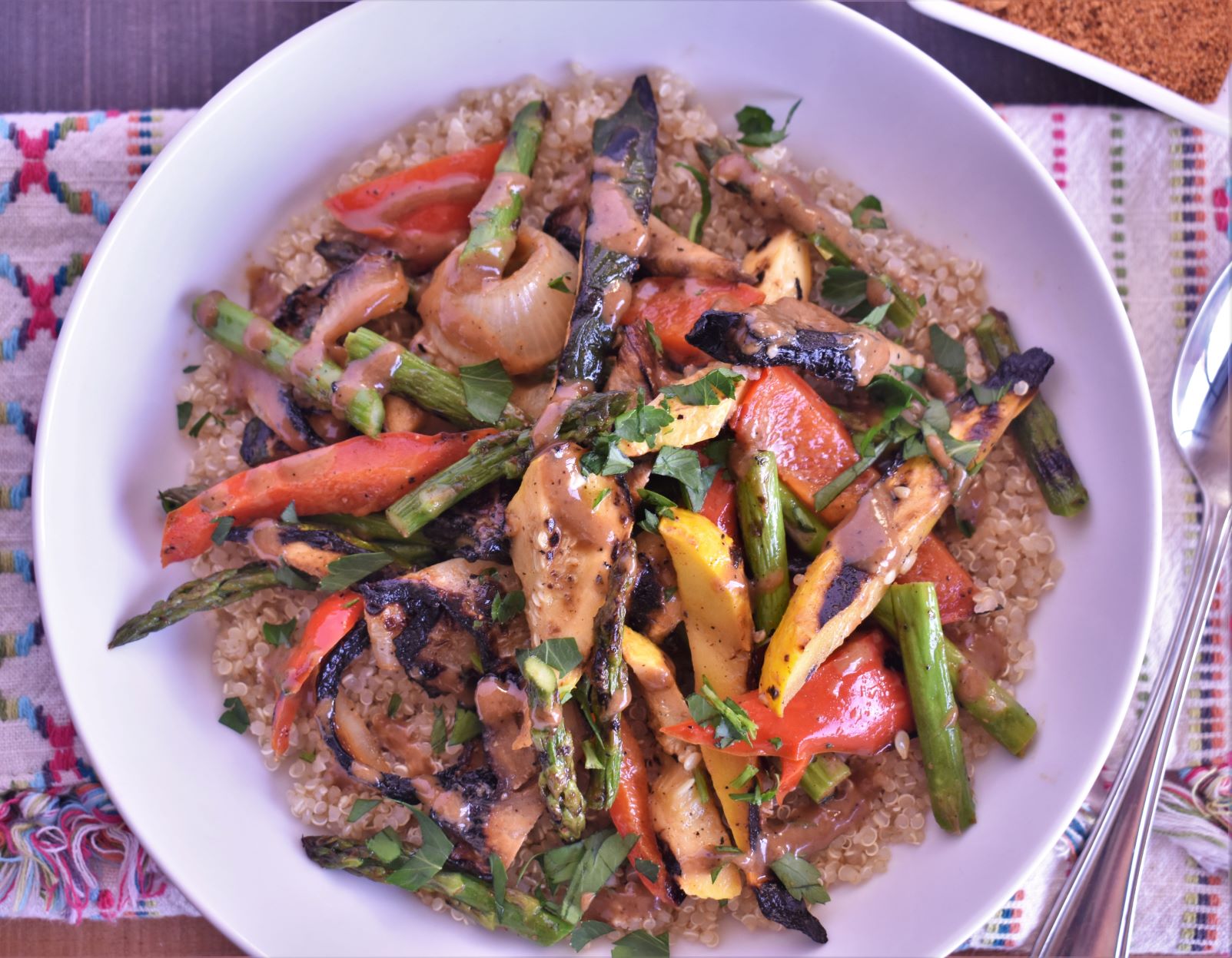 a plate of roasted vegetable and quinoa bowl