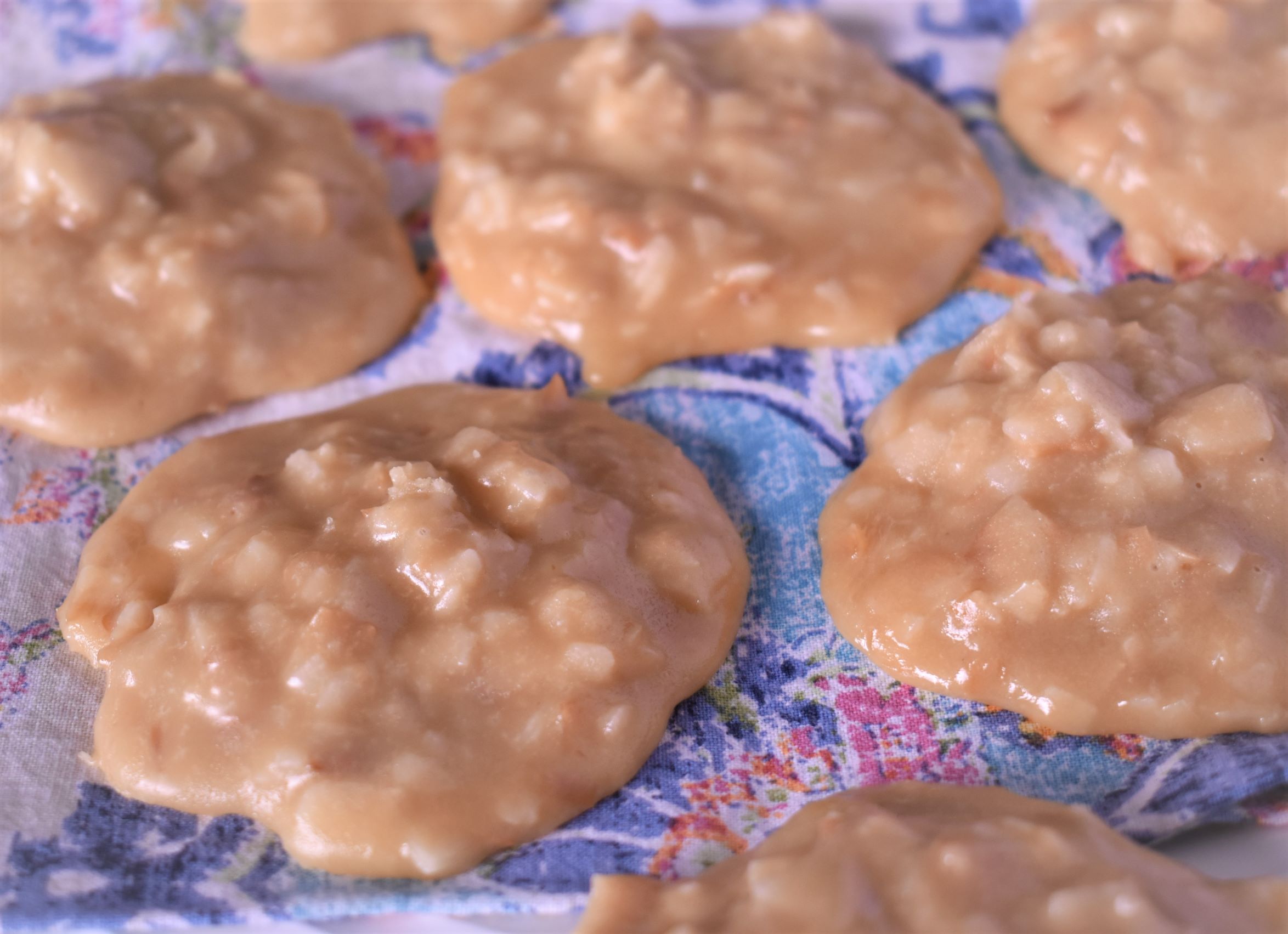 7 fresh coconut pralines on a table cloth