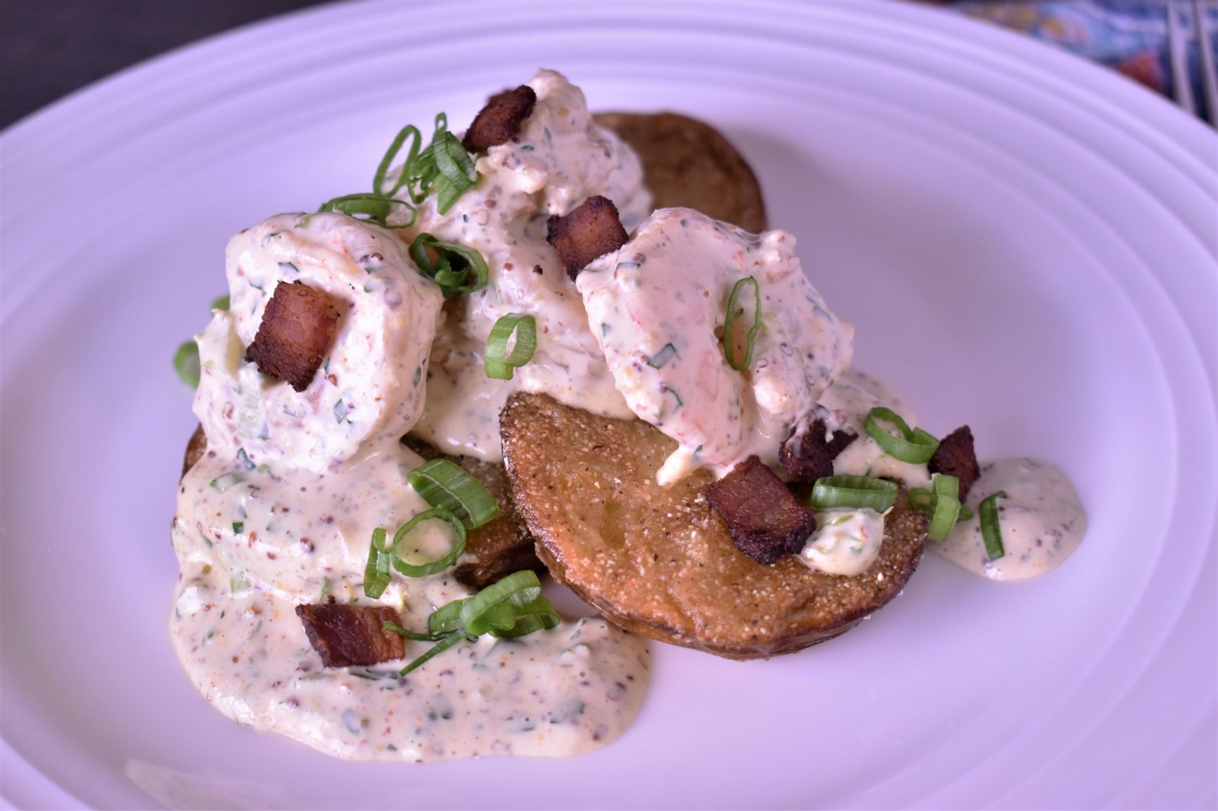 a plate of fried green tomatoes with shrimp remoulade