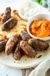 a plate full of macedonian kebapi and ajvar