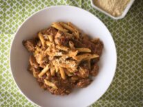 a plate of pastalaya and a type of meat