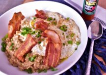 a plate of vaory oatmeal breakfast bowl with eggs, bacon and oatmeal