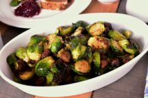 a serving bowl full of brussel sprouts