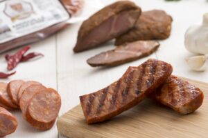 various meats in the smoked meat bundle including sausage, tasso and andouille