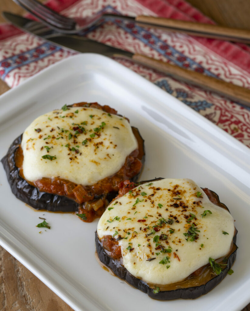 a plate of 2 eggplant parmesan