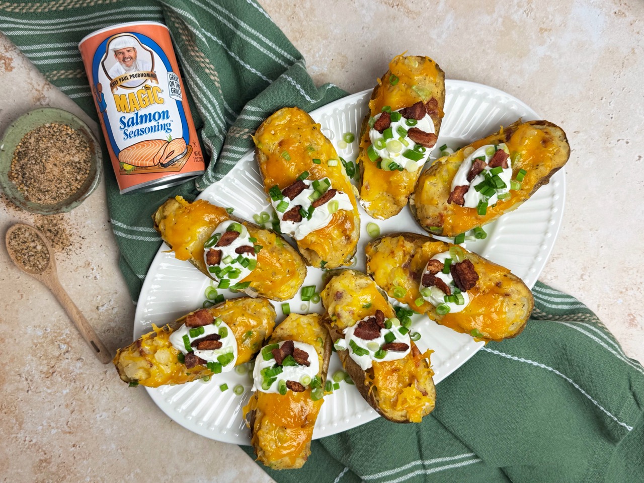 twice baked potatoes topped with cheese, a dallop of sour cream and green onions