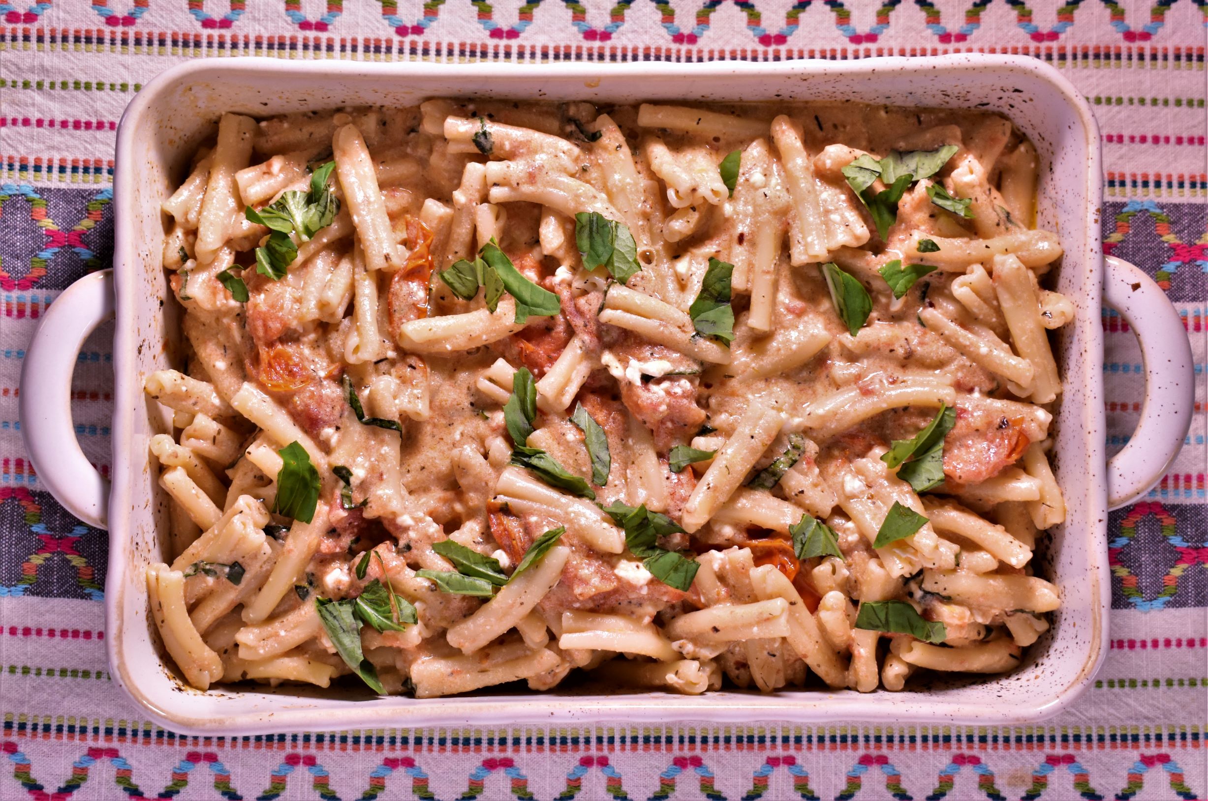 a pan full of baked feta and tomate pasta