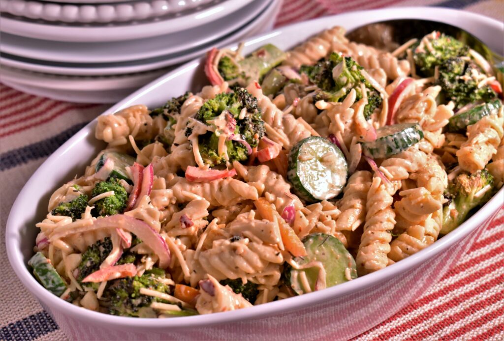 a bowl of roasted broccoli pasta salad