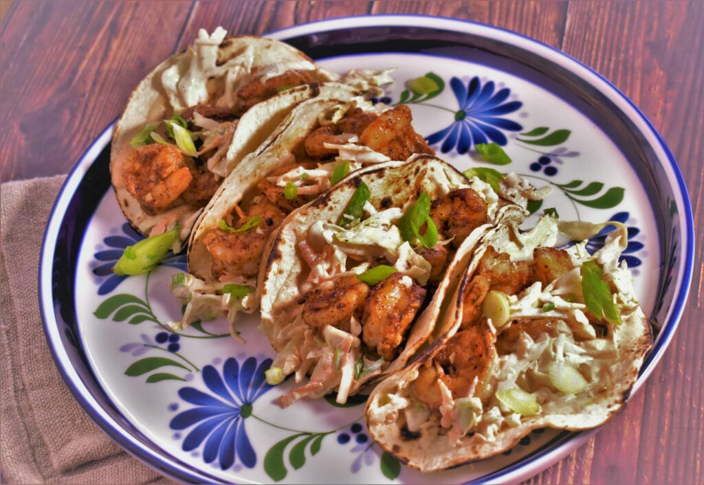 a plate of 4 blackened shrimp tacos