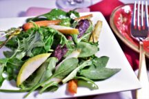 a close up of a plate of champagne vinaigrette salad