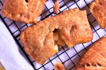 A piece of air fryer mini apple fruit pie on an oven rack