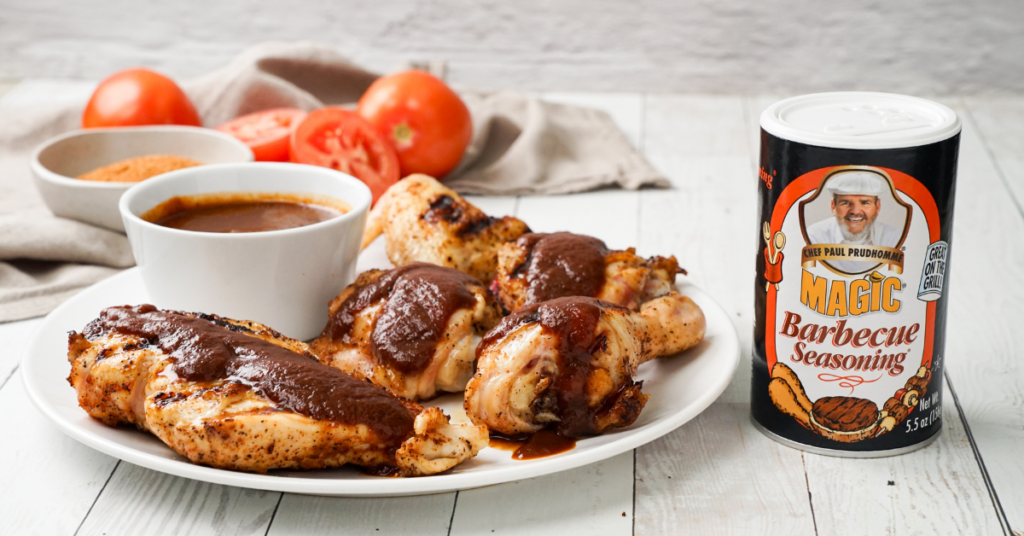 A plate of Barbecue Chicken pieces with a small bowl of sauce and a canister of Barbecue Seasoning on the side