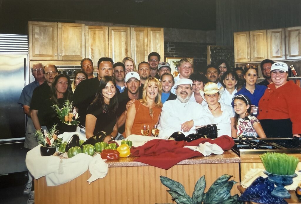 WYES set for cooking show A group of people standing behind a kitchen counter