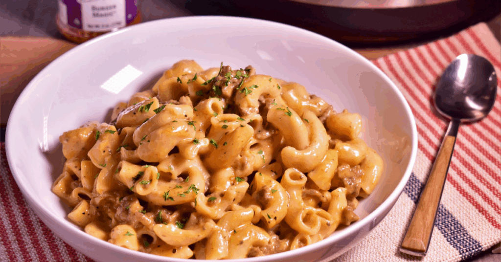 A delicious instant pot beef and macaroni casserole, featuring tender beef, pasta, and a creamy cheese sauce.