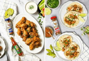 Overhead view of two game-day dishes styled on a light surface: on the left, a platter of crispy, sauced chicken wings garnished with herbs, served with celery, carrots, and dipping sauce alongside Magic Seasoning Blends and hot sauce; on the right, a two plates of shrimp tacos and on the side a bottle of Blackened Redfish Magic seasoning.