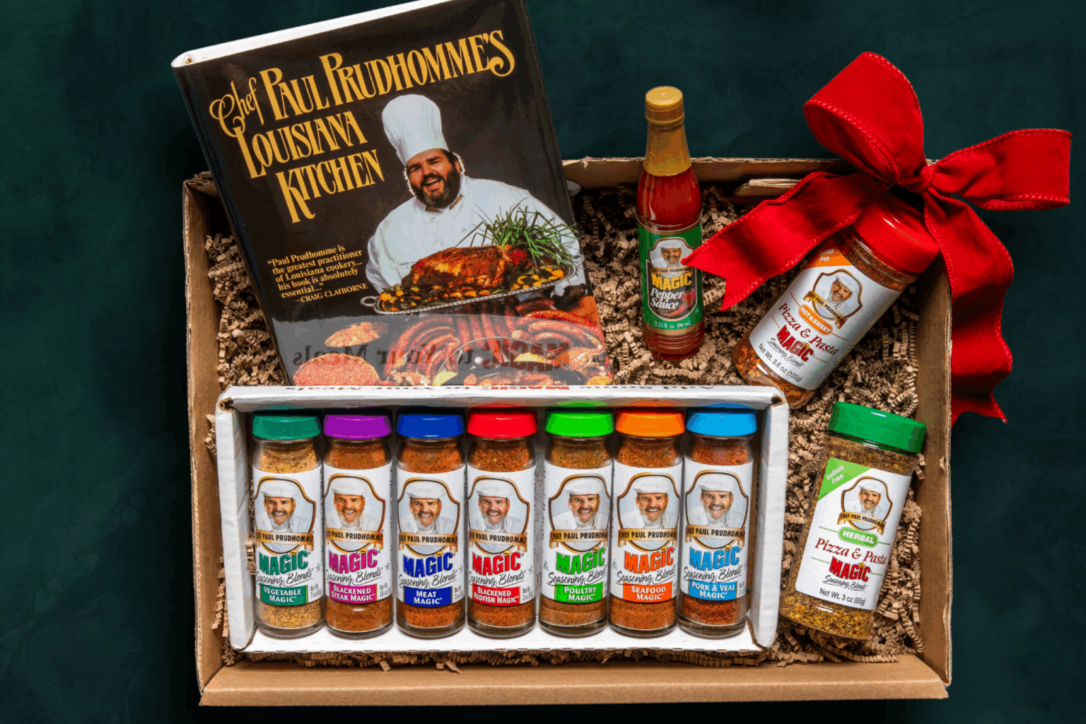 Magic seasoning gift box including Louisiana Kitchen cookbook, seasonings, sauces and a red holiday bow